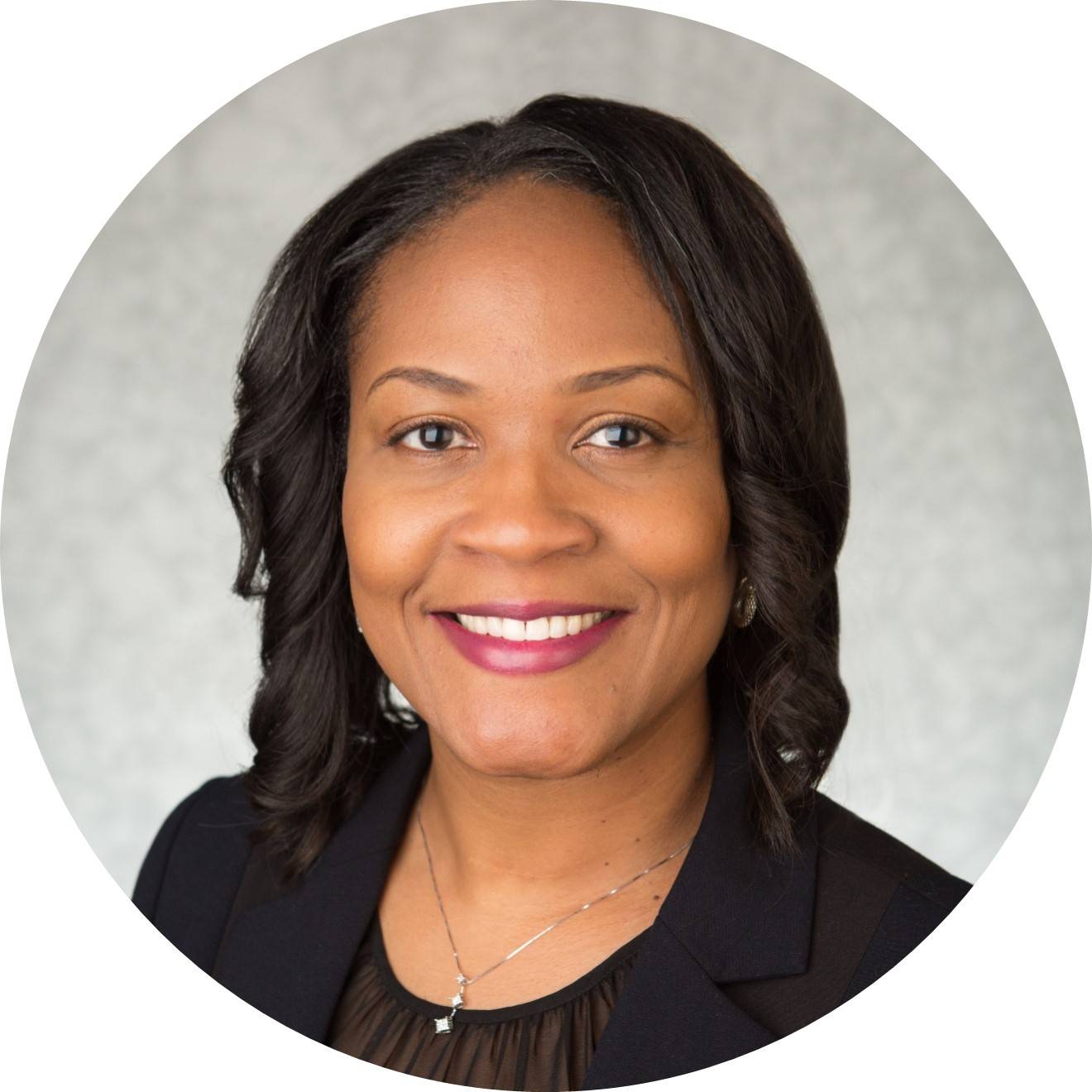 Dr. Shontaye Witcher, Ph.D., smiling for a professional photo